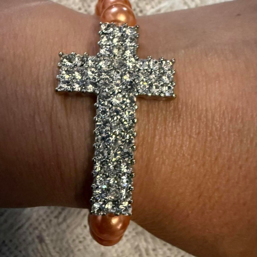 Orange pearl bracelet with silver cross